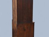 an old wooden cabinet with a mirror on top of it