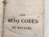 an old book that is open on a table