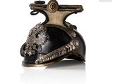 a helmet with a dragon on it on a white surface