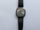an image of a wrist watch with a black strap on a white surface