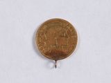 a gold coin with a picture of a man on it