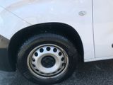 a white van that is parked on the side of the road