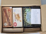 a cardboard box with a variety of items inside of it