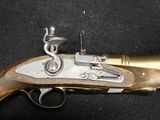an old gun that is sitting on top of a table