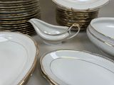 a lot of plates and saucers on the table