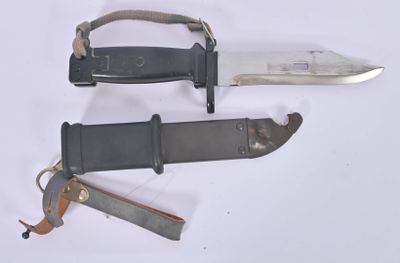 two knives that are laying next to each other on a table