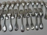 a lot of forks and spoons that are on the table