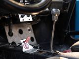 a close up of a car dashboard with a steering control