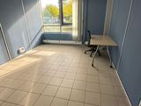a room with a desk and a chair in it