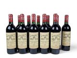 six bottles of red wine are lined up in a row