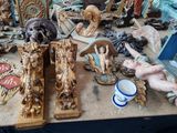 a table with a lot of antique items on it
