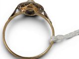 an antique gold ring with a stone in the center