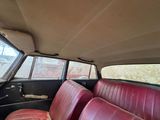 a red seat in the back seat of a car