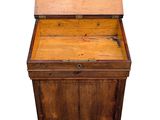 an old wooden chest with a drawer on top of it