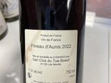 a bottle of wine that is sitting on a counter