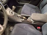 a picture of the interior of a car with a steering control