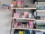 a lot of cosmetics products on the shelves in the store