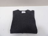 grey sweater on a white surface