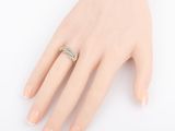 an image of a woman ' s hand with a ring on it