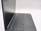 a laptop computer sitting on top of a white table