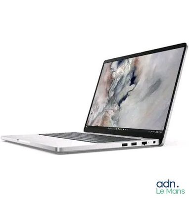 a laptop computer sitting on top of a white table