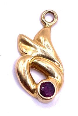 an image of a gold plated pendant with a purple stone