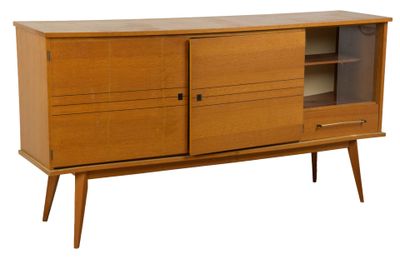 the sideboard is made of wood and has a glass door