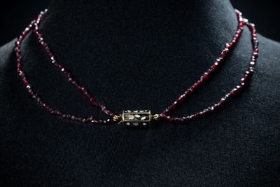 a close up of a necklace on a mannequin mannequin mannequin mannequin mannequin mannequin mannequin mannequin