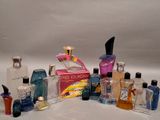 many different types of perfume bottles on a white surface
