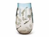 a glass vase with a fish design on it