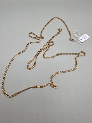 a gold chain necklace with a tag attached to it