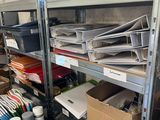 many boxes of papers on the shelves in the room