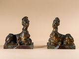 pair of antique bronze figurines of a woman and a dog