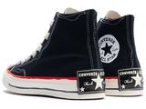 a pair of black converses with white stars on them