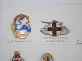 a lot of badges that are on a piece of paper