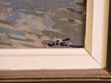 a picture of a painting on the window sill of a house