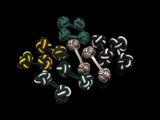 un gros plan sur un ensemble de nœuds de différentes couleurs sur fond noir