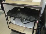 a black bag sitting on top of a shelf in a room