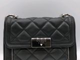 a black purse with a metal clasp on the front