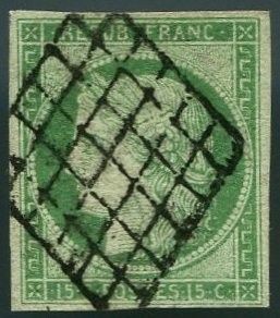 a green stamp with a picture of a woman on it