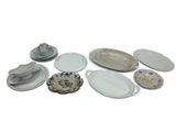a lot of plates that are sitting on a table