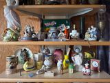a shelf with many different types of figurines on it