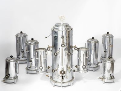 a lot of silver items that are on a white surface