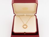 a red box with a gold necklace inside of it