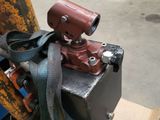 a picture of a machine with a hose attached to it ' s side