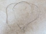 silver plated necklace with a star charm on a silver chain