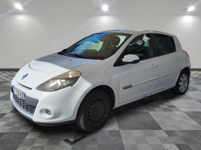 a picture of a small white car parked in a garage