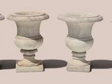 three vases sitting next to each other on a table