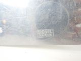 a reflection of a person in the mirror of a car