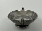 an image of a silver bowl on a white surface